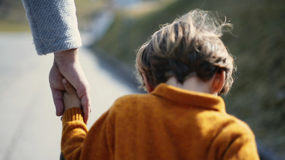 Boy walking with parent child counseling pittsboro